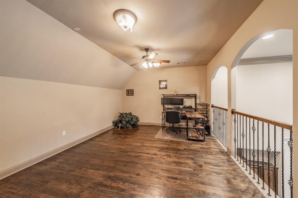575 Rockingham Drive Irving, TX 75063 - Photo 32 of 38 an empty room with furniture and a chandelier fan