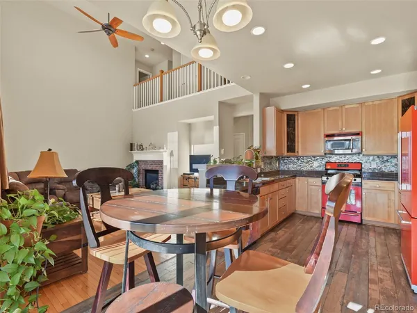 a dining room with furniture and wooden floor