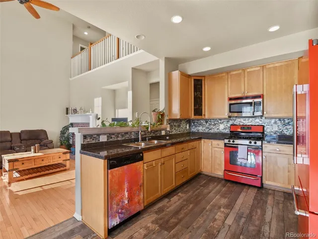 a kitchen with stainless steel appliances granite countertop a stove and a sink