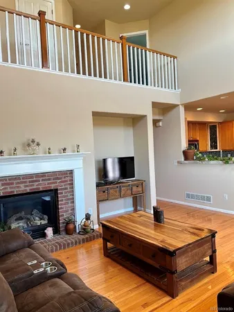 a living room with furniture fireplace and flat screen tv