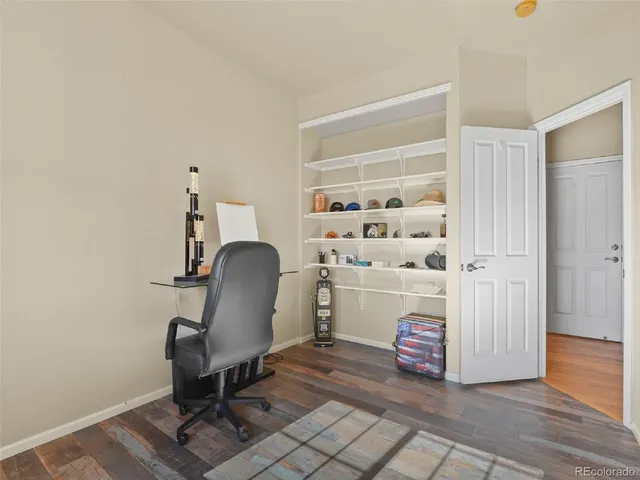 a room with a chair and a wooden floor