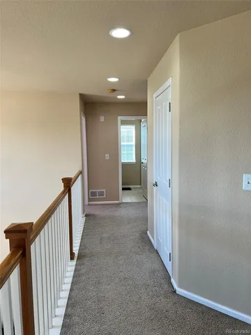 a view of a hallway with a livingroom