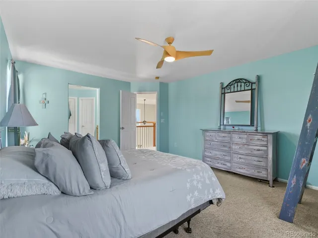 a bedroom with a bed and cabinets
