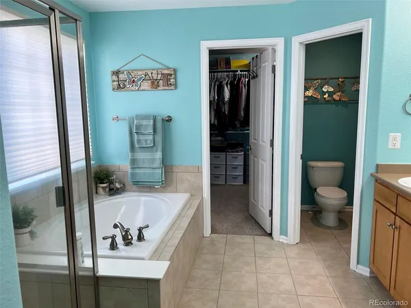 a bathroom with a toilet sink and shower