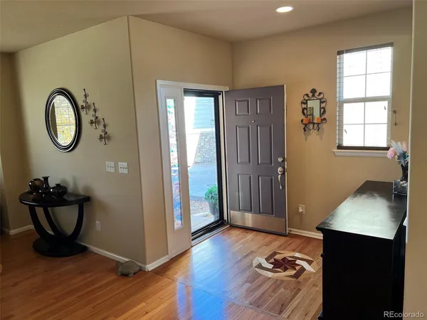 a view of room with window and wooden floor