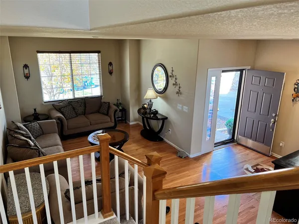 a view of a livingroom with furniture and windows