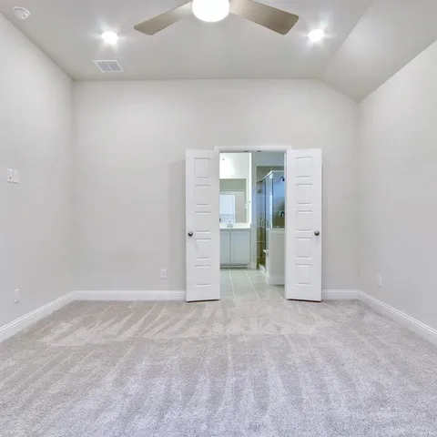 an empty room with an entrance to other room
