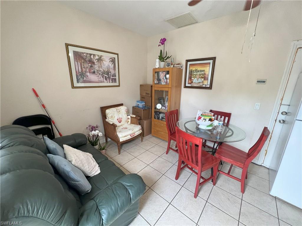 1716 48th Street Southwest Naples, FL 34116 - Photo 16 of 23 a living room with furniture and a couch