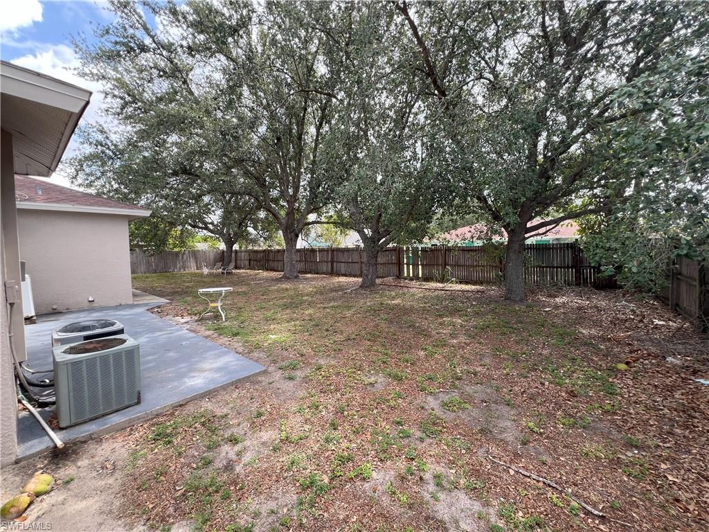 1716 48th Street Southwest Naples, FL 34116 - Photo 21 of 23 a backyard of a house with barbeque oven