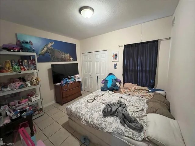 a bed room with a bed and a window