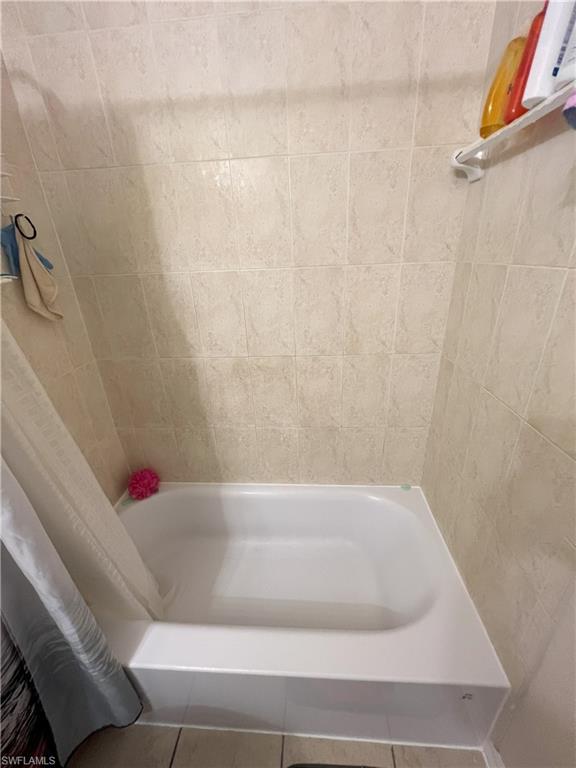 1716 48th Street Southwest Naples, FL 34116 - Photo 9 of 23 a bathroom with a bathtub