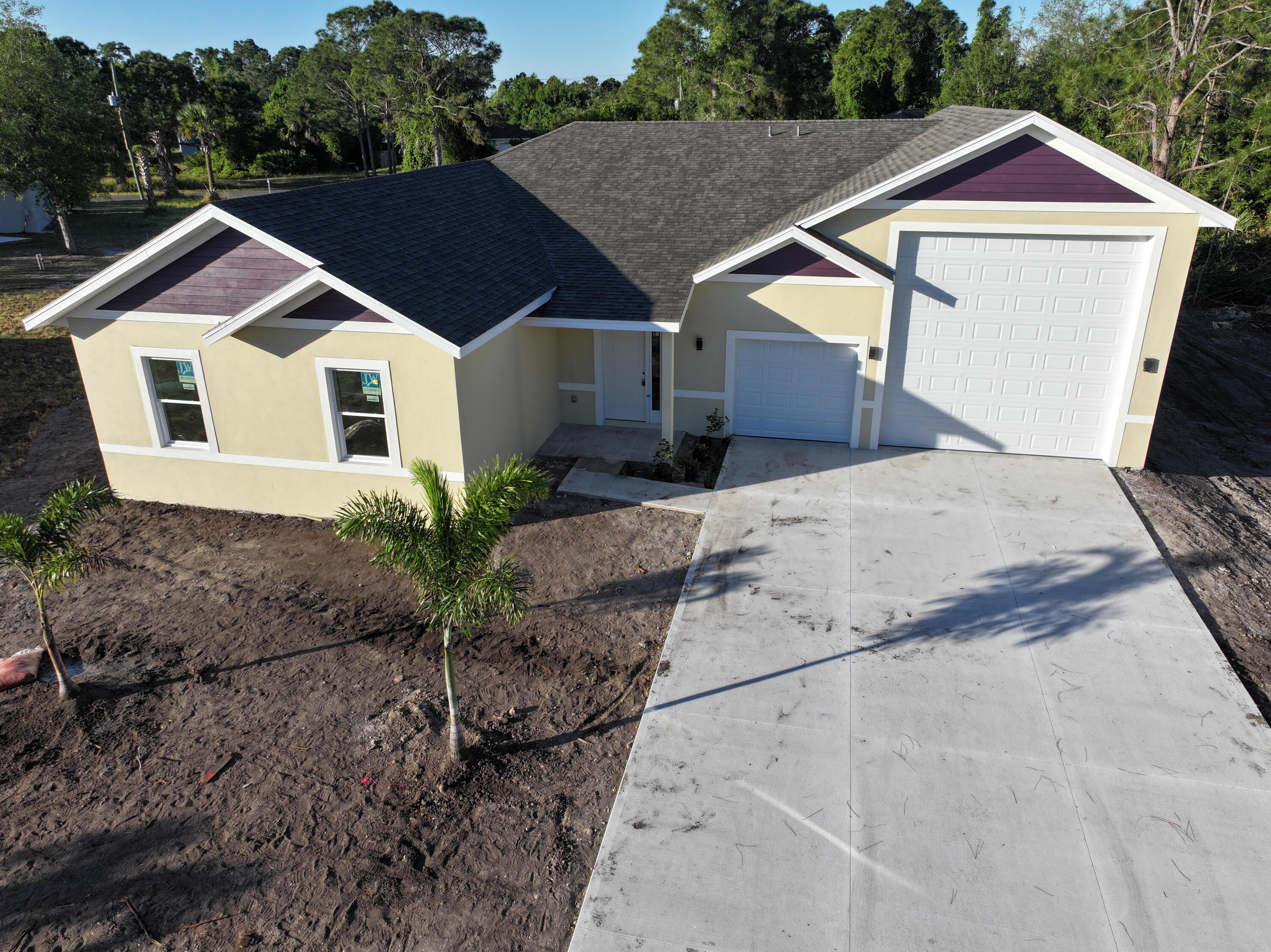 3240 Aspen Road Southeast Palm Bay, FL 32909 - Photo 2 of 12 a front view of a house with garden