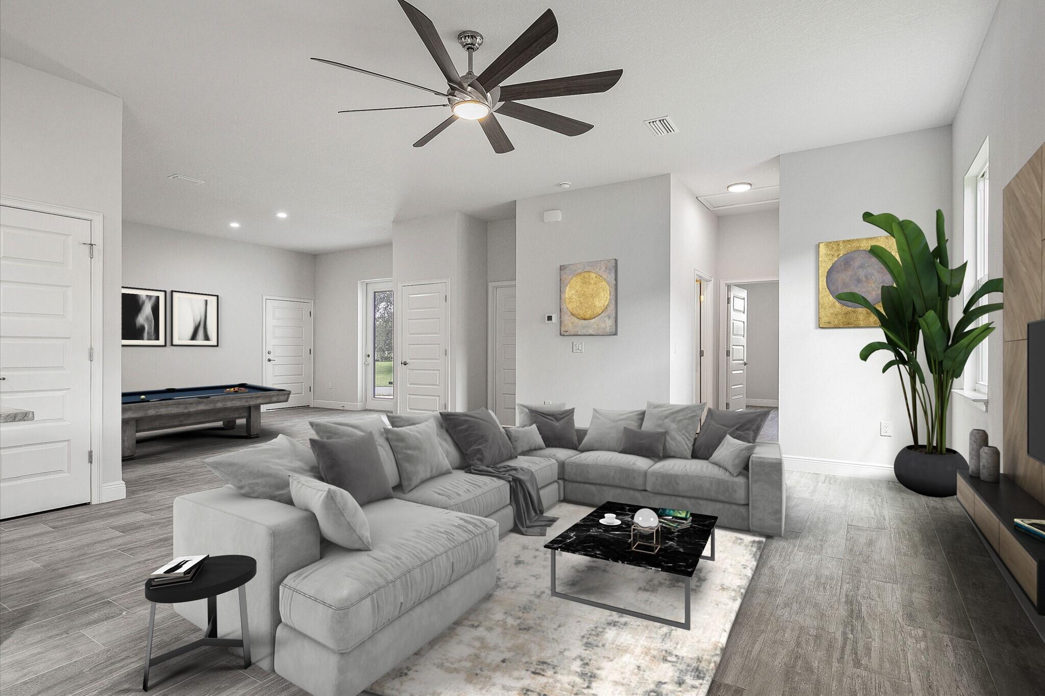 3240 Aspen Road Southeast Palm Bay, FL 32909 - Photo 4 of 12 a living room with furniture a rug and a potted plant