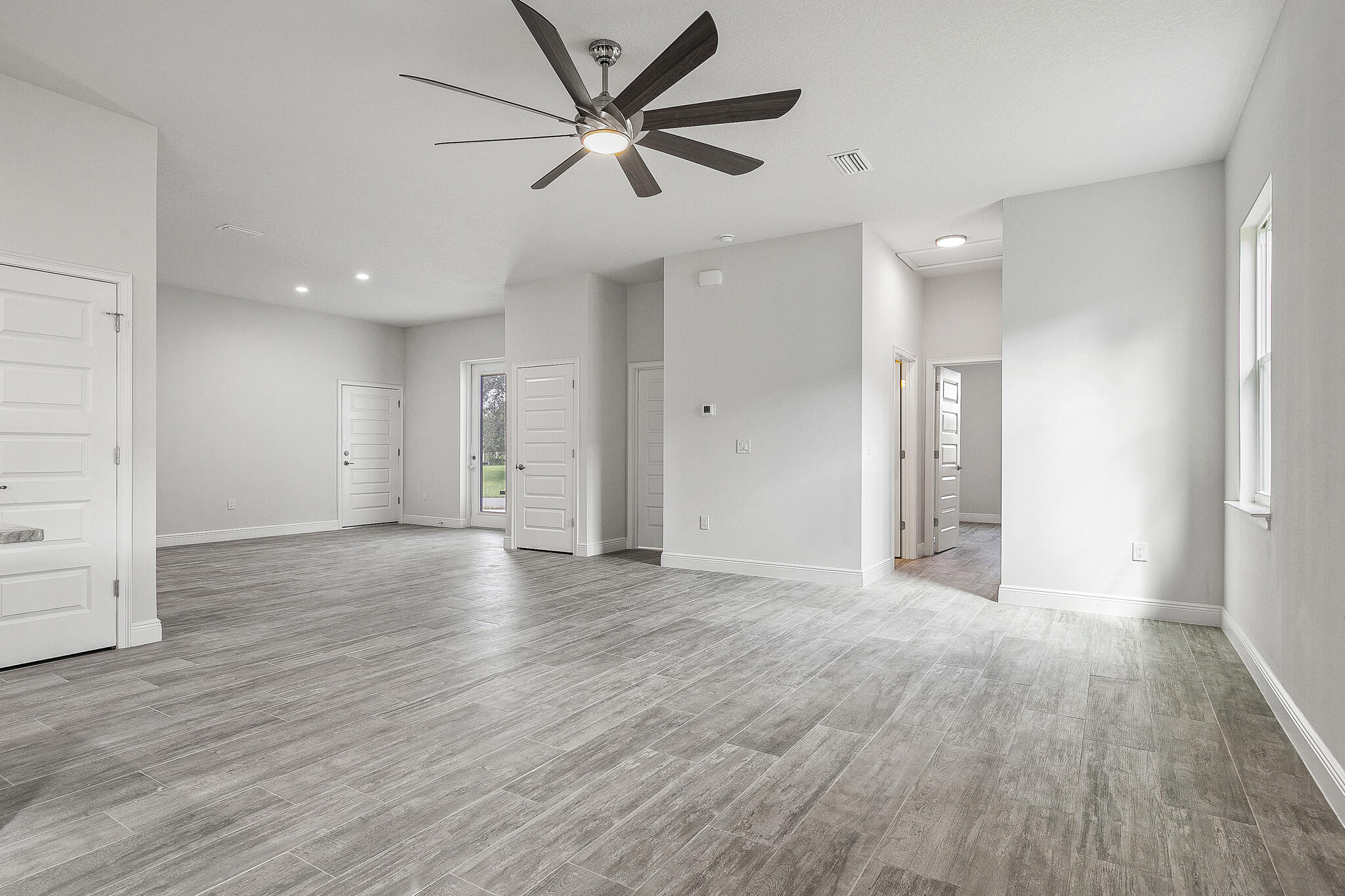 3240 Aspen Road Southeast Palm Bay, FL 32909 - Photo 6 of 12 a view of an empty room and wooden floor