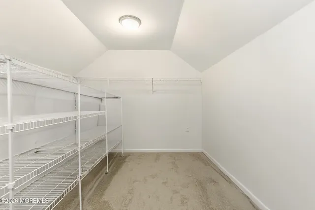 a bedroom with a bed and a ceiling fan