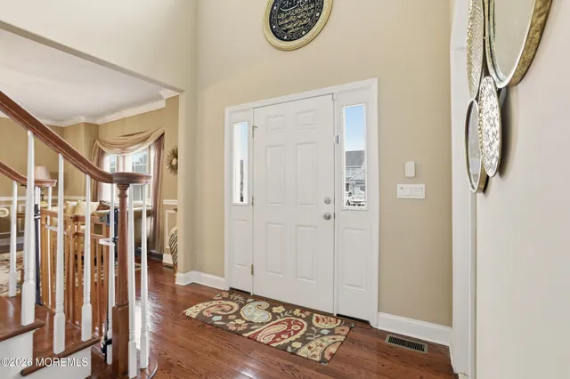 a view of entryway with wooden floor