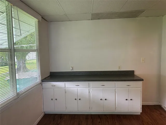 a view of room with wooden floor