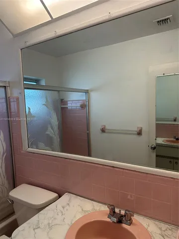 a bathroom with a sink and toilet