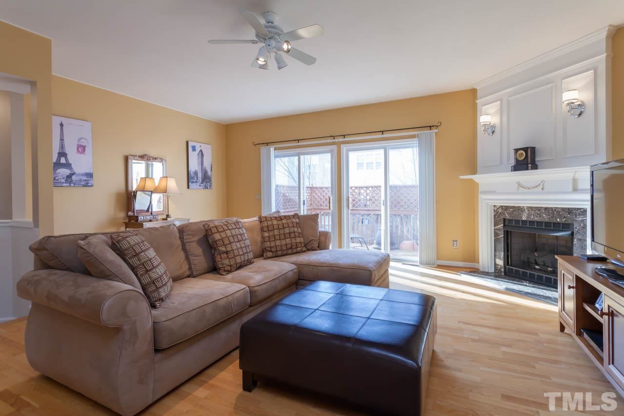 5541 Red Robin Road Raleigh, NC 27613 - Photo 2 of 23 a living room with furniture and a fireplace