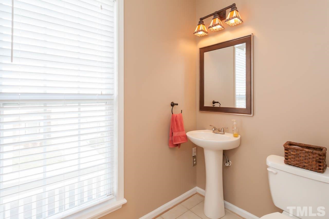 5541 Red Robin Road Raleigh, NC 27613 - Photo 12 of 23 a bathroom with a sink and a mirror