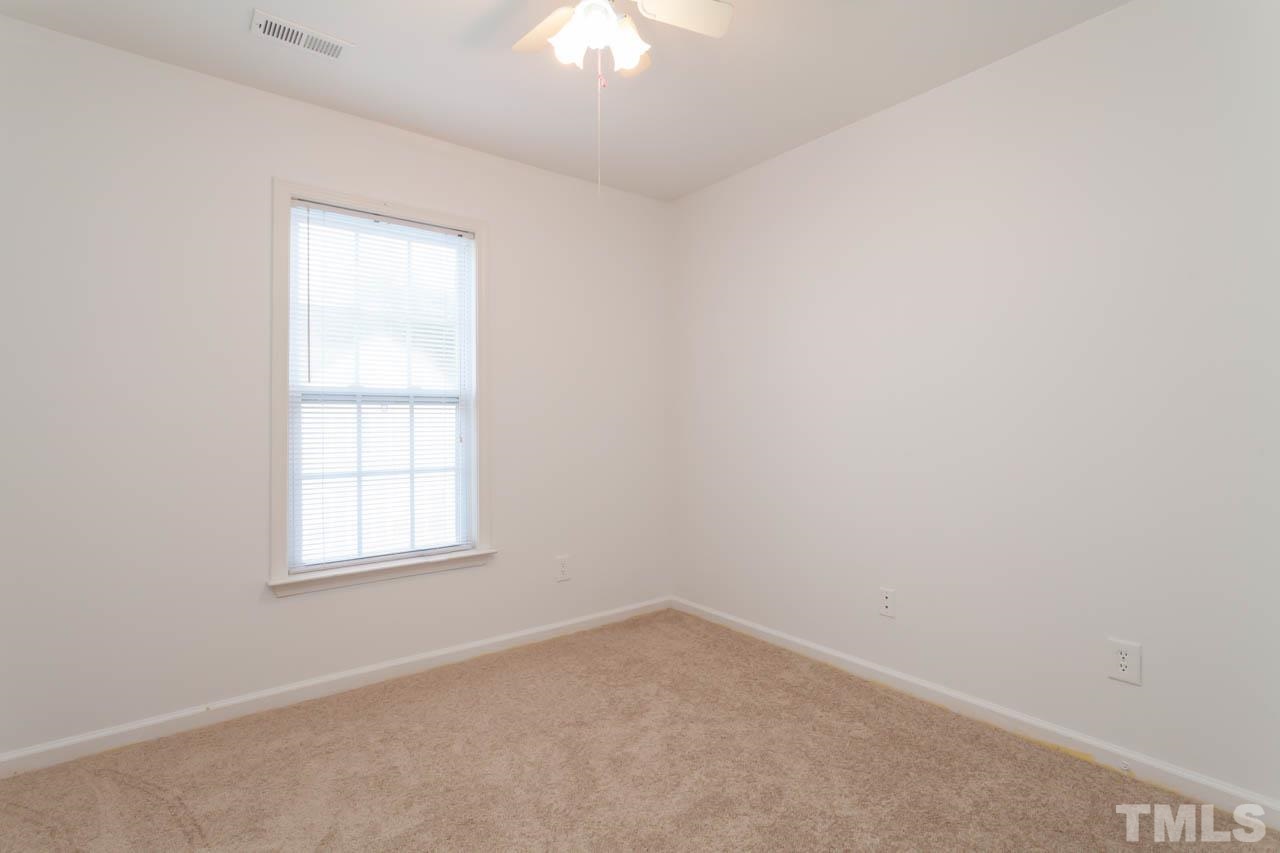 5541 Red Robin Road Raleigh, NC 27613 - Photo 14 of 23 an empty room with a window