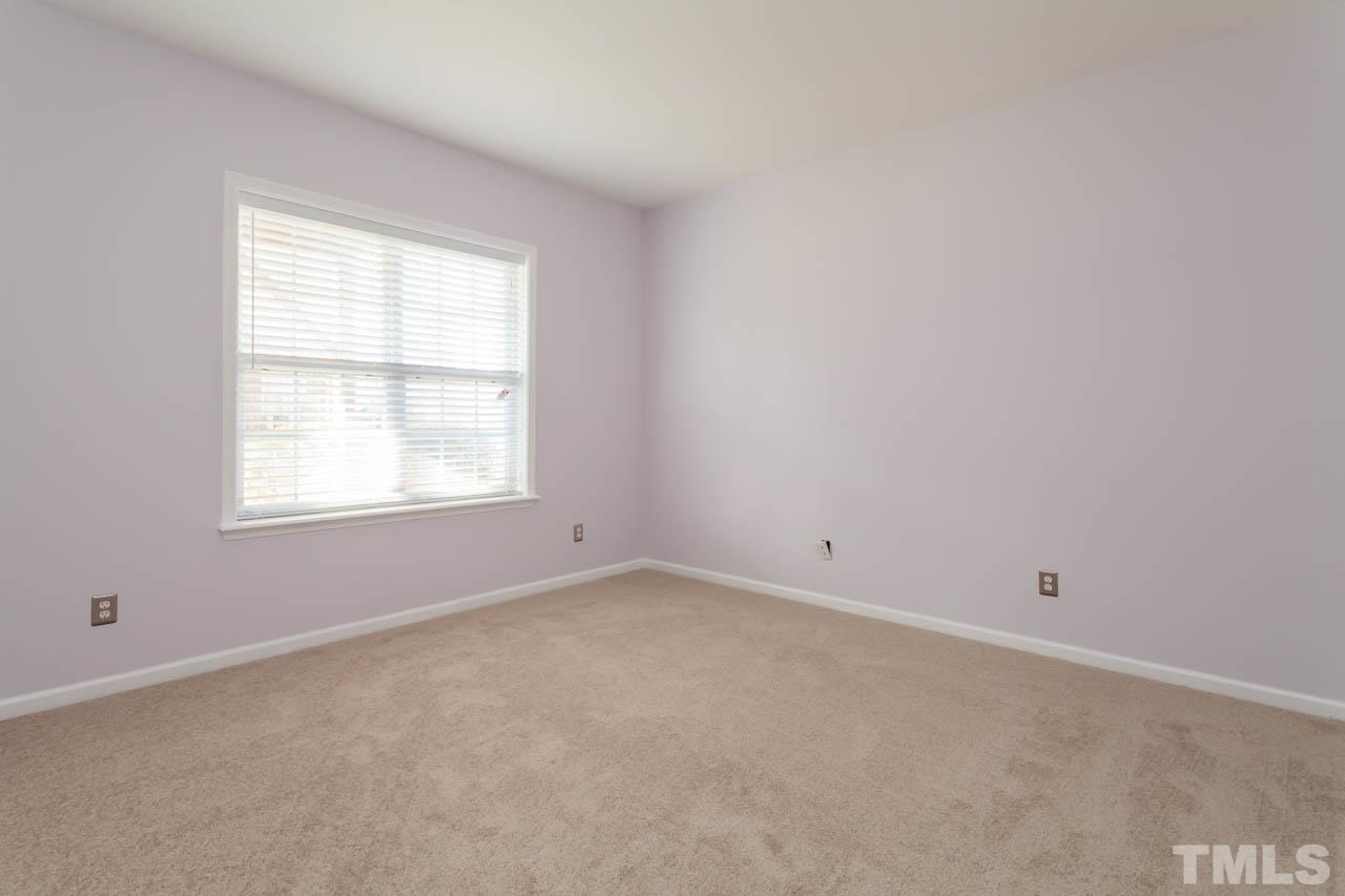 5541 Red Robin Road Raleigh, NC 27613 - Photo 16 of 23 an empty room with a window