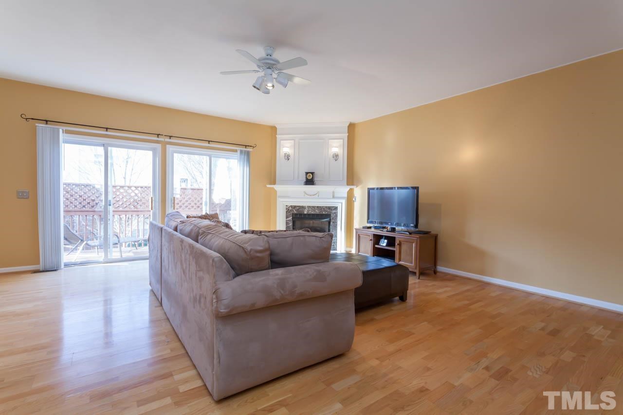 5541 Red Robin Road Raleigh, NC 27613 - Photo 3 of 23 a living room with furniture and a fireplace