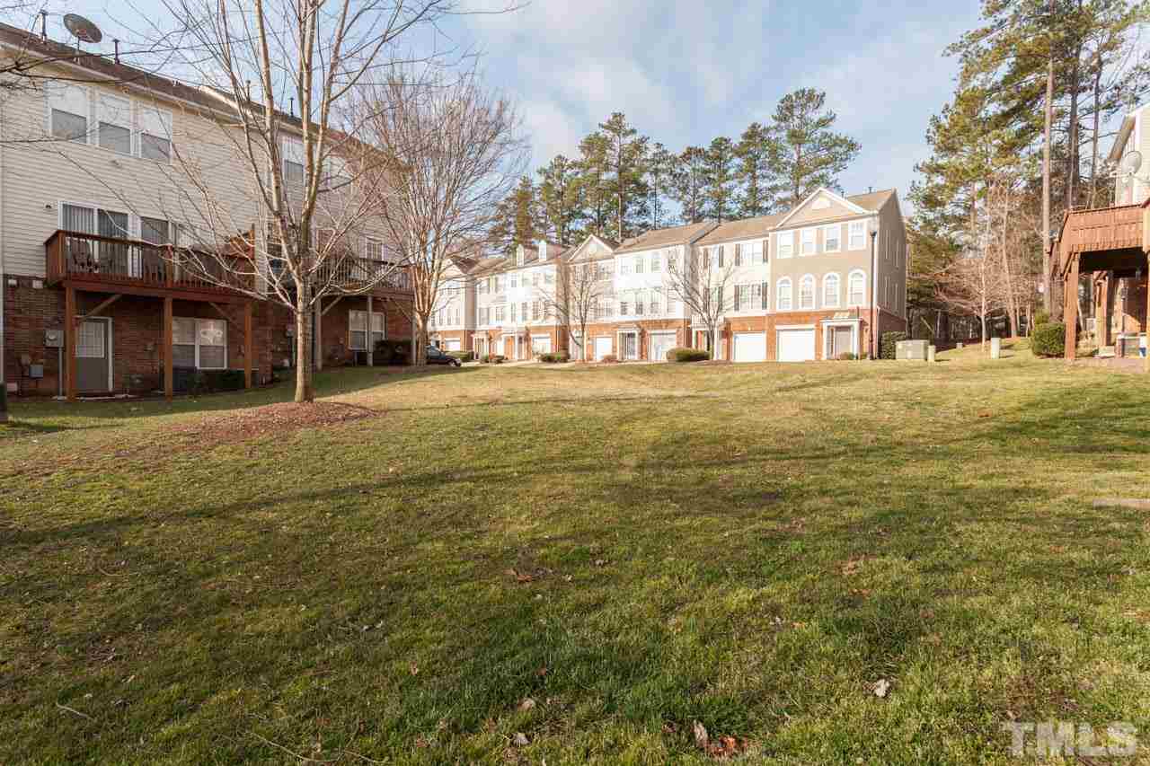 5541 Red Robin Road Raleigh, NC 27613 - Photo 21 of 23 a big yard with trees in front of it