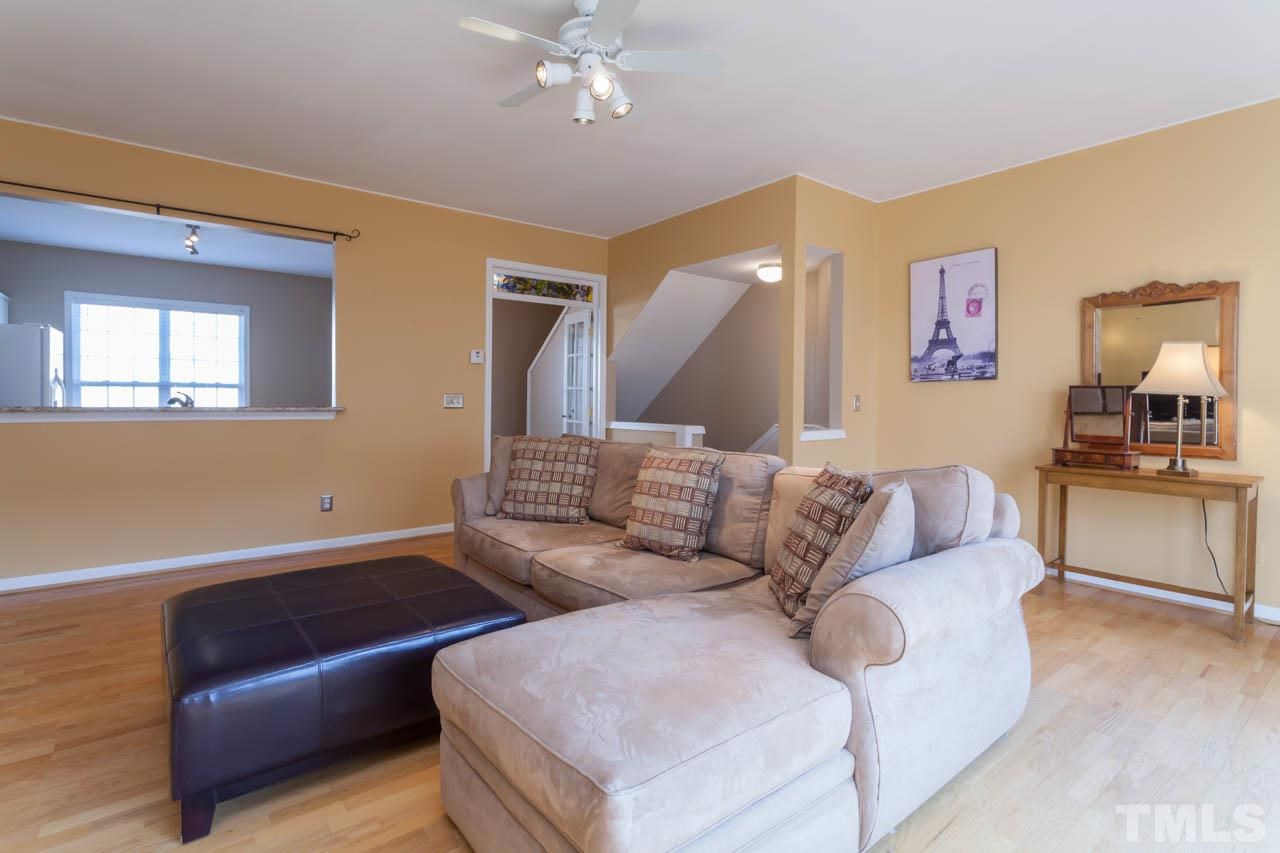 5541 Red Robin Road Raleigh, NC 27613 - Photo 4 of 23 a living room with furniture and a couch