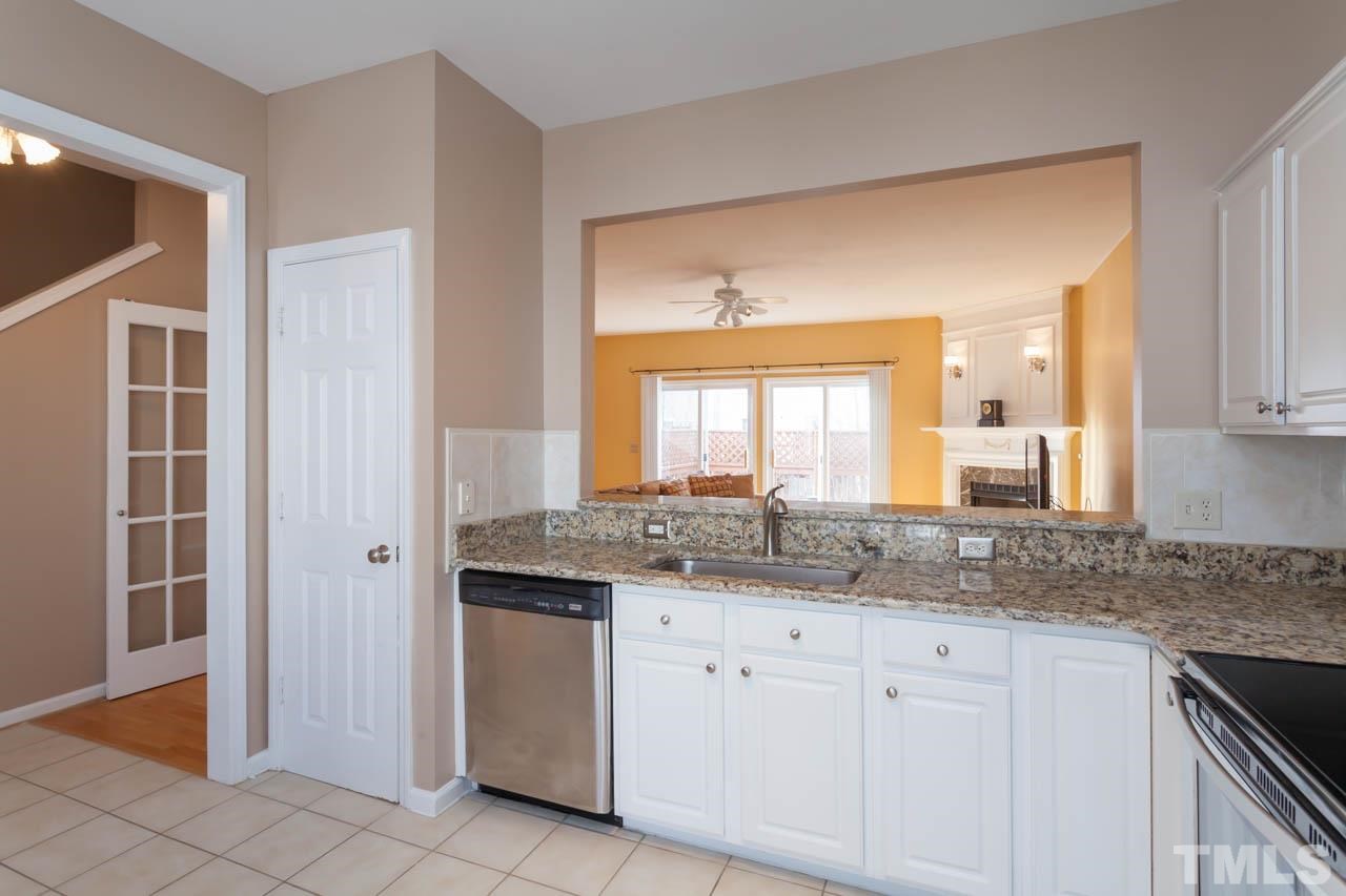 5541 Red Robin Road Raleigh, NC 27613 - Photo 7 of 23 a bathroom with a granite countertop sink and a mirror