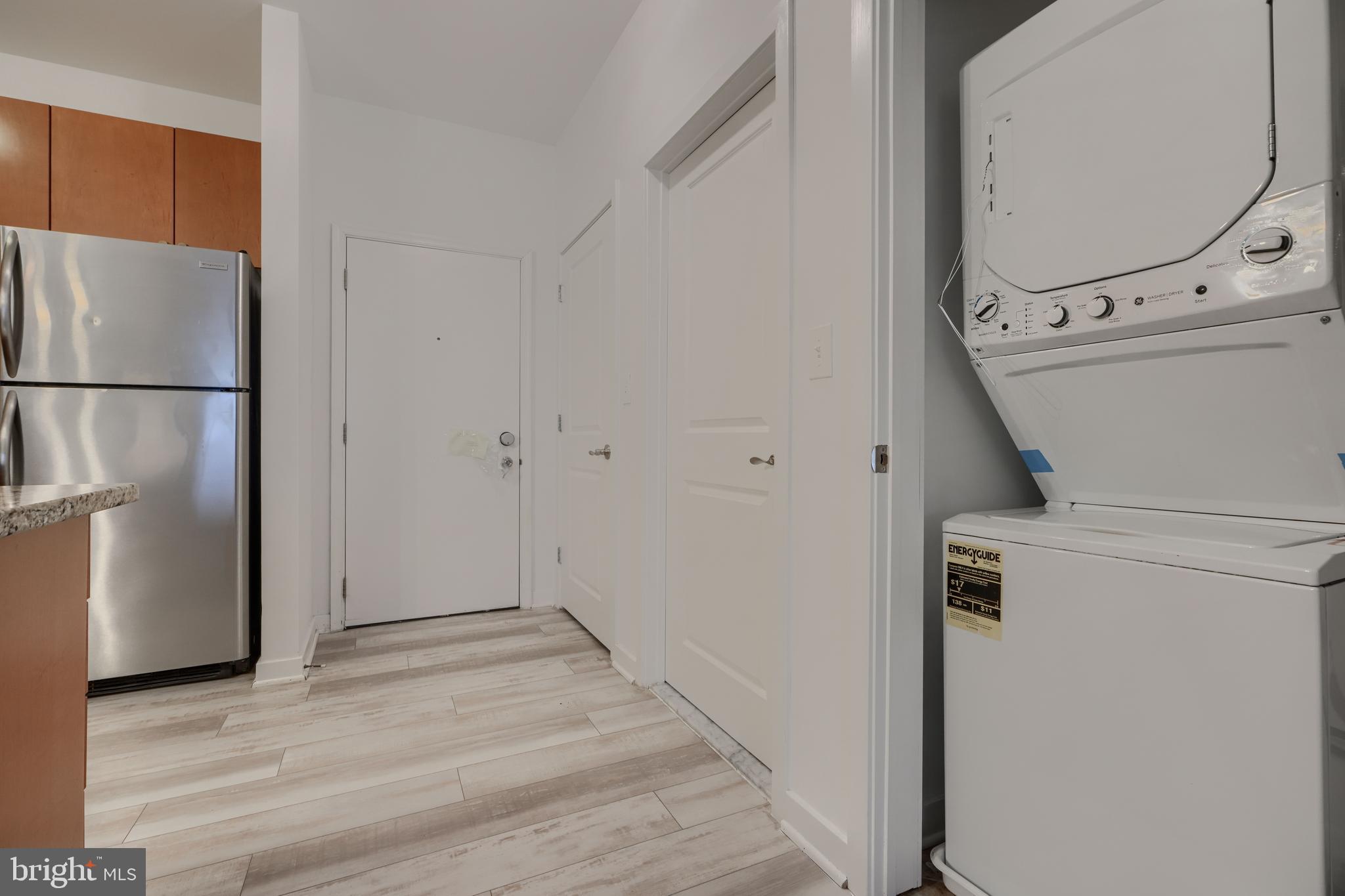 3201 St Paul Street, Unit 210 Baltimore, MD 21218 - Photo 18 of 38 a view of a kitchen with refrigerator