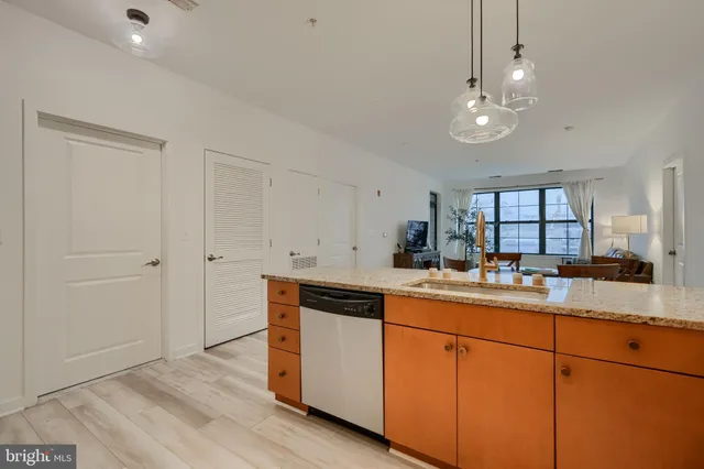 a kitchen with sink and cabinets