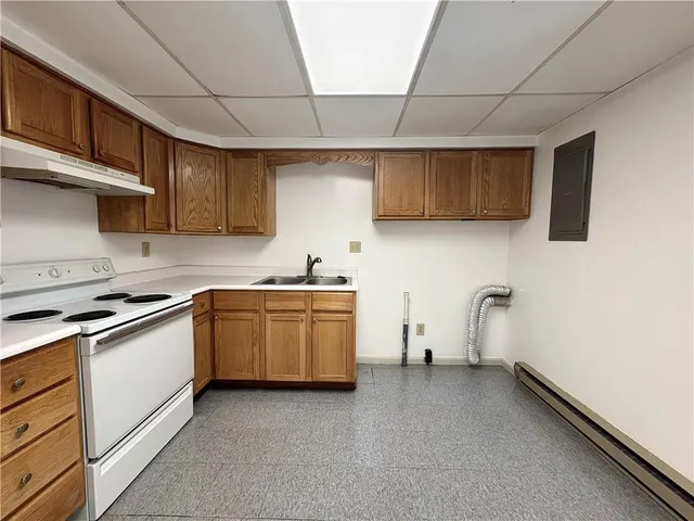 a kitchen with sink cabinets and microwave