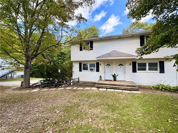 a front view of a house with a yard