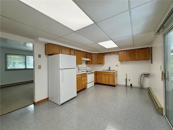 a kitchen with stainless steel appliances a refrigerator and a sink