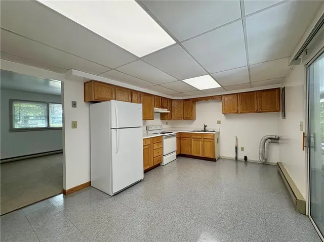 a kitchen with stainless steel appliances a refrigerator and a sink