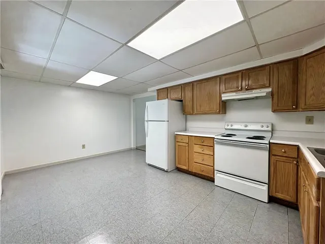 a kitchen with a stove and a refrigerator