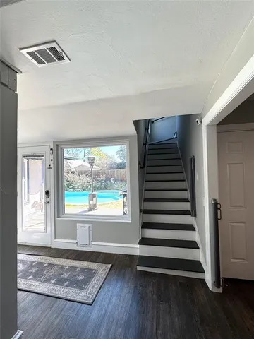 a house with trees in the background