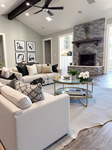 a living room with furniture and a fireplace