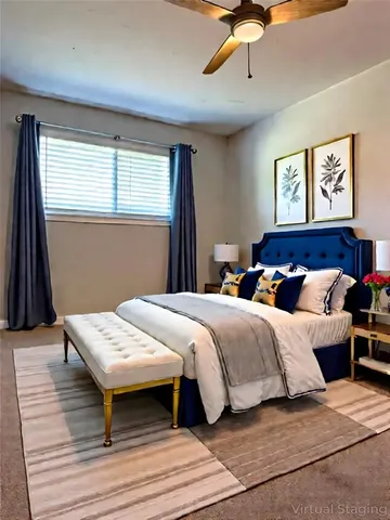 a bedroom with bed and a window