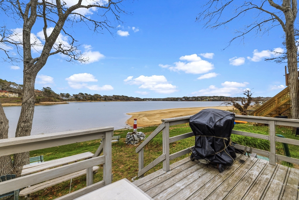 9 F Hideaway Road, Unit 11 Bourne, MA 02532 - Photo 12 of 24 a view of a chairs on the deck