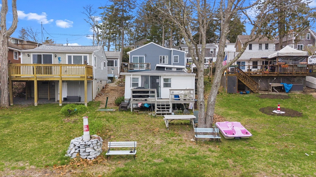 9 F Hideaway Road, Unit 11 Bourne, MA 02532 - Photo 14 of 24 a front view of a house with garden