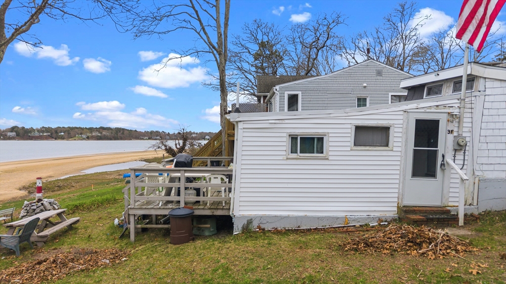 9 F Hideaway Road, Unit 11 Bourne, MA 02532 - Photo 16 of 24 a view of a chairs and table on the terrace