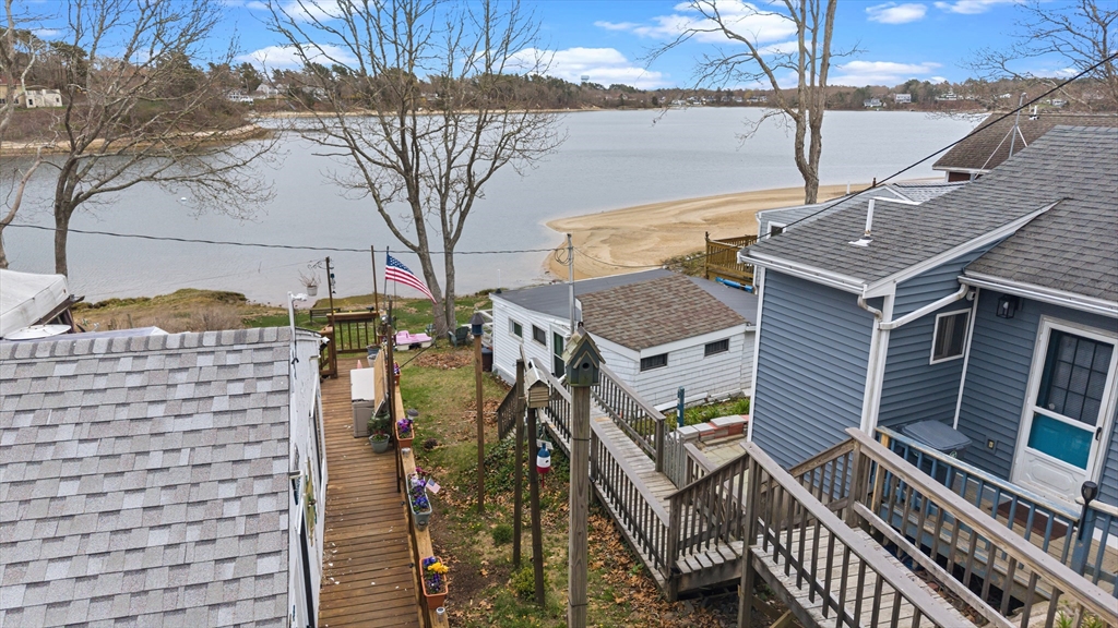 9 F Hideaway Road, Unit 11 Bourne, MA 02532 - Photo 18 of 24 a view of a house with wooden stairs