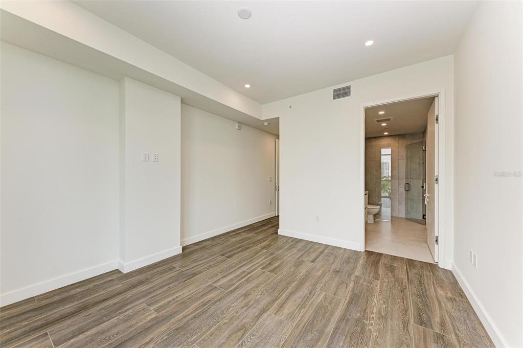 111 Golden Gate Point, Unit 402 Sarasota, FL 34236 - Photo 41 of 79 wooden floor in an empty room