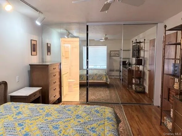 a bedroom with a bed and a view of bathroom