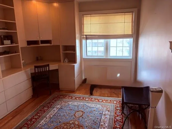 a view of kitchen with furniture and a window