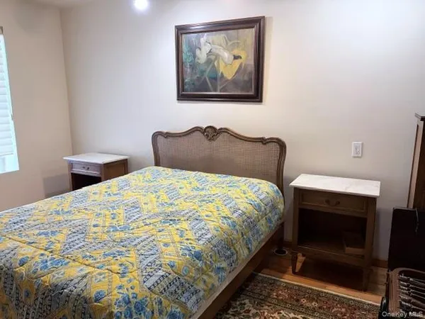 a bedroom with a bed and a stove