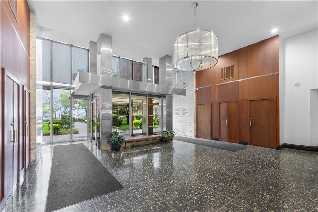 9201 Shore Road, Unit C508 Brooklyn, NY 11209 - Photo 15 of 15 a view of a hallway with windows
