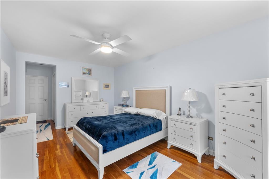 9201 Shore Road, Unit C508 Brooklyn, NY 11209 - Photo 9 of 15 a living room with a bed and furniture
